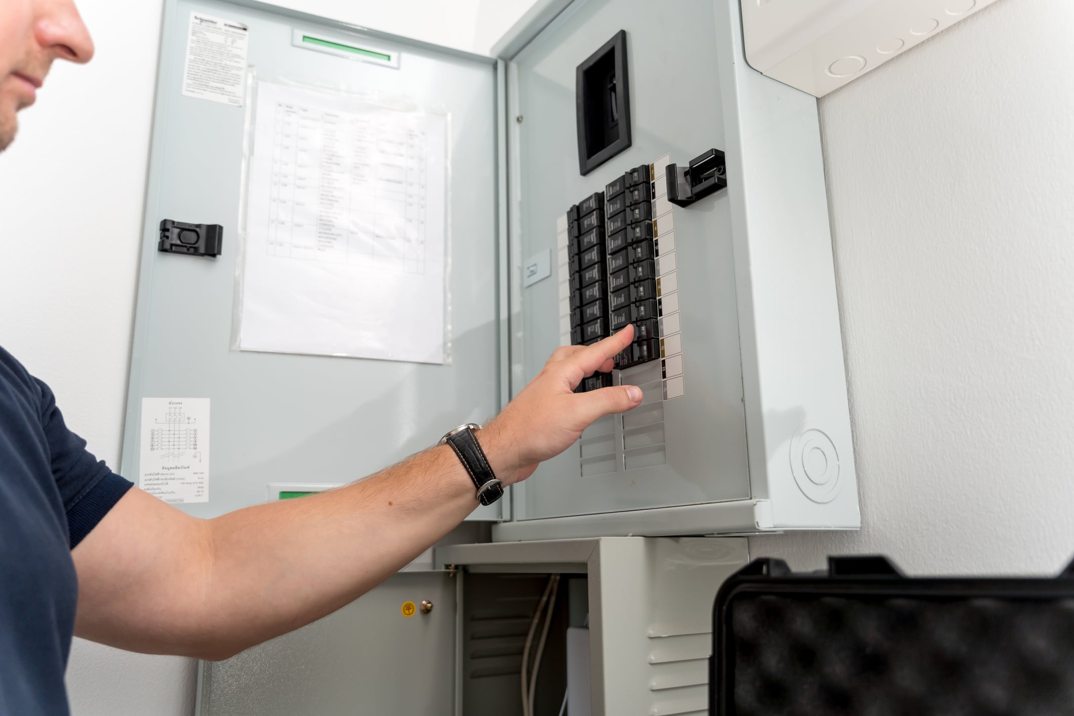 A technician works with a demo kit of the smart home system.